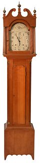 Federal Cherry Tall Clock with Tombstone Dial
having painted wooden dial and wood works
case having fluted columns
height 90 inches
Provenance: Fifty 