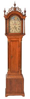 Timothy Barnes Cherry Tall Clock
having fret work top with three wood finials supported by fluted columns over long door flanked by fluted columns,
al