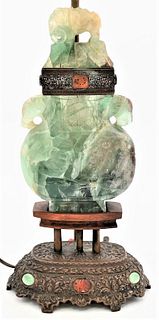 Chinese Green Quartz Urn
having carved animals, made into a table lamp on bronze base mounted with stones
overall height 29 inches
Provenance: Waterfr