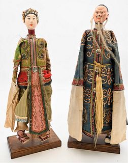 Pair of Chinese Wood Carved Doll Figures
scholar wearing a silk robe, and a guanyan with tattered silk robe, 
19th century
height 19 1/2 inches