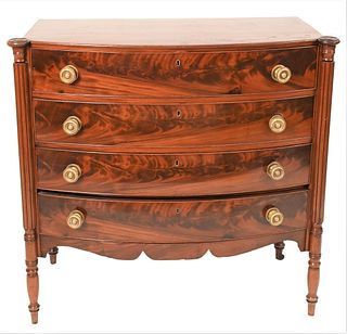 Sheraton Mahogany Four Drawer Chest having bowed front and turret corners circa 1830 height 38 1/2 inches, top 19 1/2 x 41 inches 