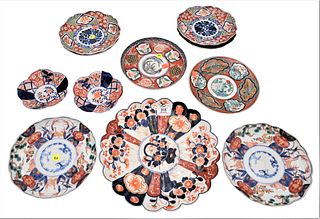 Group of 11 Imari Porcelain Dishes
to include a set of 4 plates, signed on bottom
diameter 8 3/8 inches; charger having scallop edge (cracked), diamet