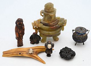 Group of Assorted Asian Items
to include Netsuke of masks, two Netsuke carved figures,
carved scholar
enameled and filigree tea bag strainer
along wit