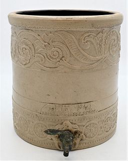 Stoneware Crock 
spigot with pinwheels and floral designs
marked Natural Tripoli Stone
height 12 inches
Provenance: Estate of Bruce Sasalla, East Hart