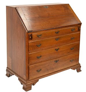 Walnut Chippendale Deskhaving slant lid over four drawers set on ogee feet, interior with center shell carved door flanked by fluted columnsprobably