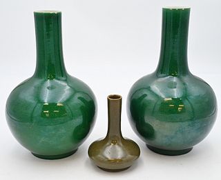 Three Chinese Vases
to include pair of Chinese porcelain vases in globular form with slender neck having green apple crackle glaze,
along with a tea d
