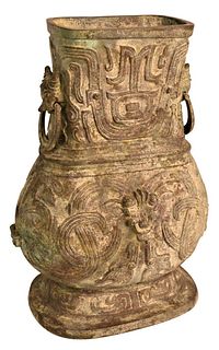 Large Chinese Bronze Vase
having archaic style with incised details
animal form head
handles with rings
height 18 inches
Provenance: From a private Ne