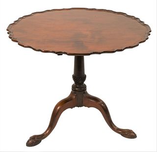 Chippendale Mahogany Tip Table
having pie crust top on urn turned shaft set on tripod base
height 26 3/4 inches, diameter 29 3/4 inches
