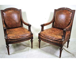 PAIR OF ITALIAN EMBOSSED LEATHER ARMCHAIRS