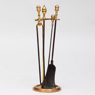Set of Three Brass and Metal Fireplace Tools and a Stand