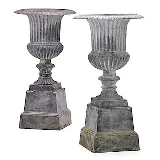 PAIR OF GALVANIZED METAL URNS ON STANDS