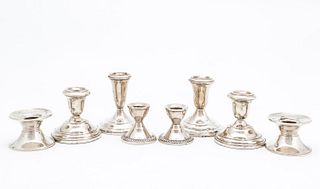 GROUP OF 8 WEIGHTED STERLING SILVER CANDLESTICKS