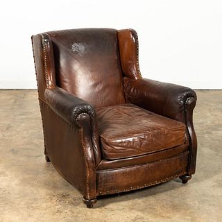 BROWN LEATHER UPHOLSTERED LOUNGE CHAIR