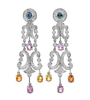 Pair of long earrings with movement in 18k white gold.