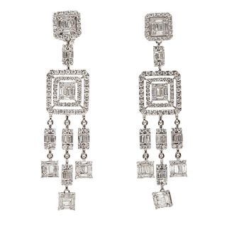 Pair of long earrings with movement made in 18kt white gold,