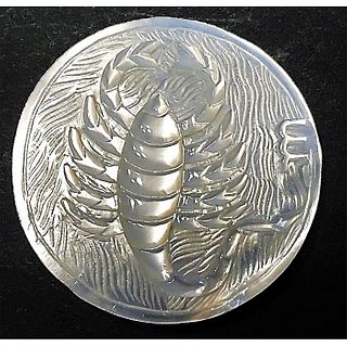 A DIVISION THREE CARVED PEARL LOBSTER BUTTON