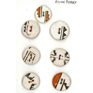 A SMALL CARD OF DIVISION THREE ACOMA POTTERY BUTTONS