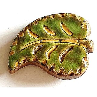 A DIVISION THREE SAMMOTH POTTERY BUTTON