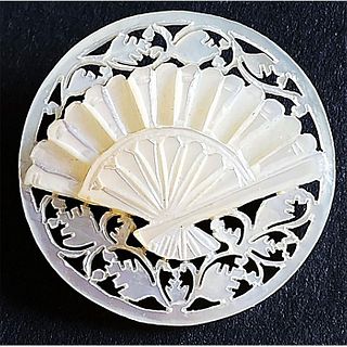 A 20TH CENTURY CARVED AND PIERCED BETHLEHEM PEARL BUTTON