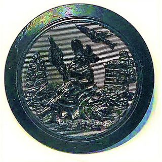 A DIVISION ONE BLACK DYED FIGURAL HORN BUTTON