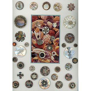 A CARD OF DIVISION ONE PEARL BUTTONS INCL. PASTE OME
