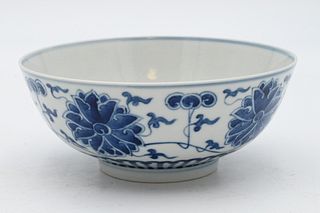 Chinese Blue and White Porcelain Flower Bowl
having painted blue lotus flowers
six character marks and wax seal on bottom
height 2 1/2 inches, diamete