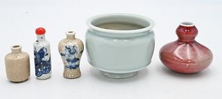 Five Piece Chinese Porcelain Group
to include crackle glazed bottles, a blue, white and iron red snuff bottle, red glazed bottle vase, along with a ce