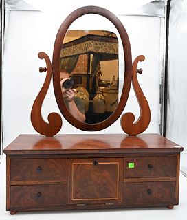 Unusual Federal Mahogany Shaving Mirror
having center door opening to reveal three satin wood drawers, flanked by two drawers on either side that lock