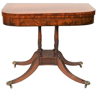 Federal Mahogany Game Tableset on four carved and turned supports on base, set on four down swept members ending in brass paw circa 1820height 31 3
