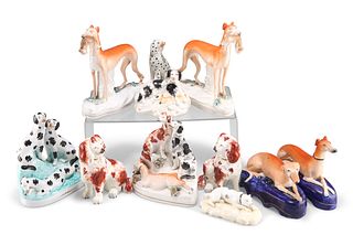 A COLLECTION OF STAFFORDSHIRE POTTERY DOG MODELS, 19TH CENTURY, including a