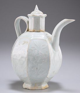 A CHINESE LONGQUAN CELADON WINE EWER, MING DYNASTY, of foliate-moulded octa