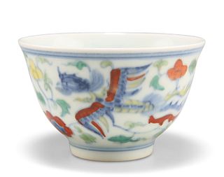 A CHINESE DOUCAI CUP, painted with phoenix and foliage, bears Chenghua six 