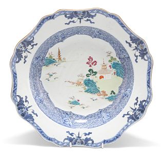 AN 18TH CENTURY CHINESE FAMILLE ROSE BASIN, shaped circular, painted with a