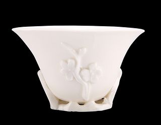 A CHINESE BLANC DE CHINE LIBATION CUP, PROBABLY KANGXI PERIOD, moulded with