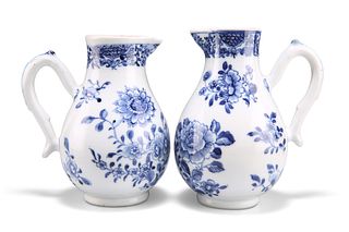 TWO 18TH CENTURY CHINESE BLUE AND WHITE CREAM JUGS, each with sparrow beak 