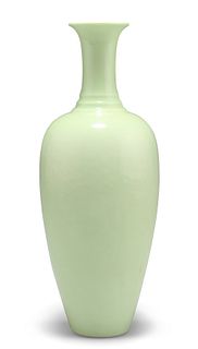 A CHINESE GREEN-GLAZED VASE, the ovoid body with tall stepped neck, bears d