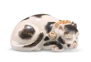A JAPANESE MEIJI PERIOD KUTANI PORCELAIN MODEL OF A SLEEPING CAT, with enam