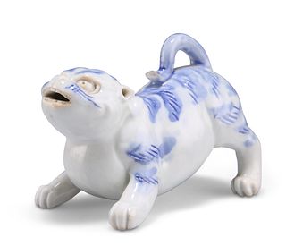 A JAPANESE HIRADO BLUE AND WHITE MODEL OF A DOG, MEIJI PERIOD, modelled in 