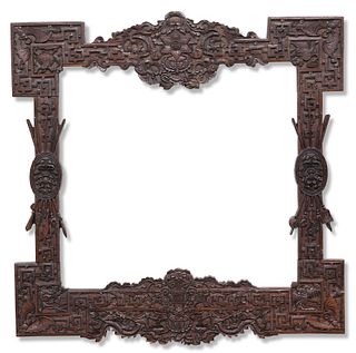 A 19TH CENTURY CHINESE HARDWOOD FRAME, deeply carved with scenes of dragons
