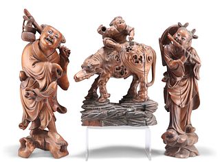 THREE 19TH CENTURY CHINESE WOODEN CARVINGS, including a group depicting a m