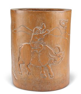 A 19TH CENTURY CHINESE BAMBOO BRUSH POT, carved in low relief with a boy ri
