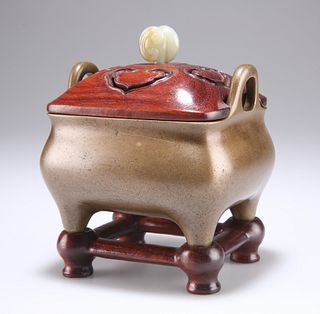 A CHINESE BRONZE CENSER, rounded rectangular with loop handles, the pierced