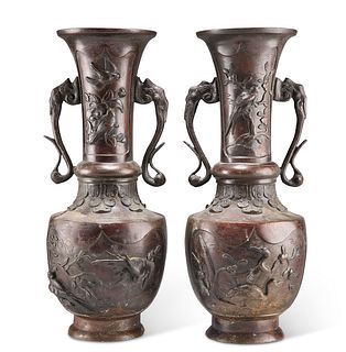 A PAIR OF JAPANESE BRONZE TWO-HANDLED VASES, MEIJI PERIOD, cast in relief w
