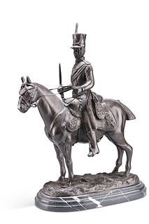 A PATINATED BRONZE GROUP OF A FRENCH HUSSAR ON HORSEBACK, signed in the cas