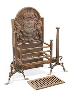AN IMPRESSIVE CAST IRON FIRE GRATE, freestanding, the arched back panel wit