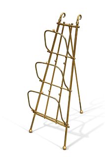 AN EDWARDIAN BRASS THREE DIVISION COLLAPSIBLE NEWSPAPER RACK, of tapering e