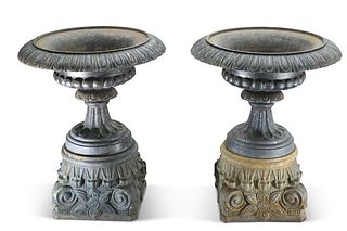 A LARGE AND IMPRESSIVE PAIR OF CAST IRON URNS, of campana-form, raised on c