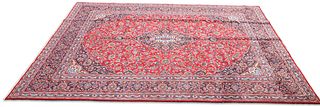 AN IRANIAN HAND-KNOTTED WOOL CARPET, KHORASAN, the brick red field with all