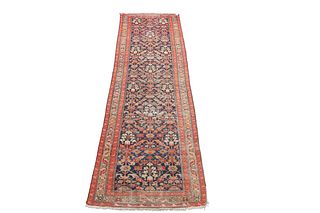 A MALAYER RUNNER, CIRCA 1930, the dark blue field with all-over orange and 