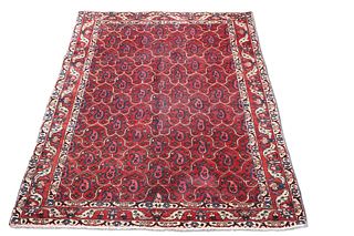 A FINELY WOVEN IRANIAN CARPET, the brick red field with all-over boteh desi